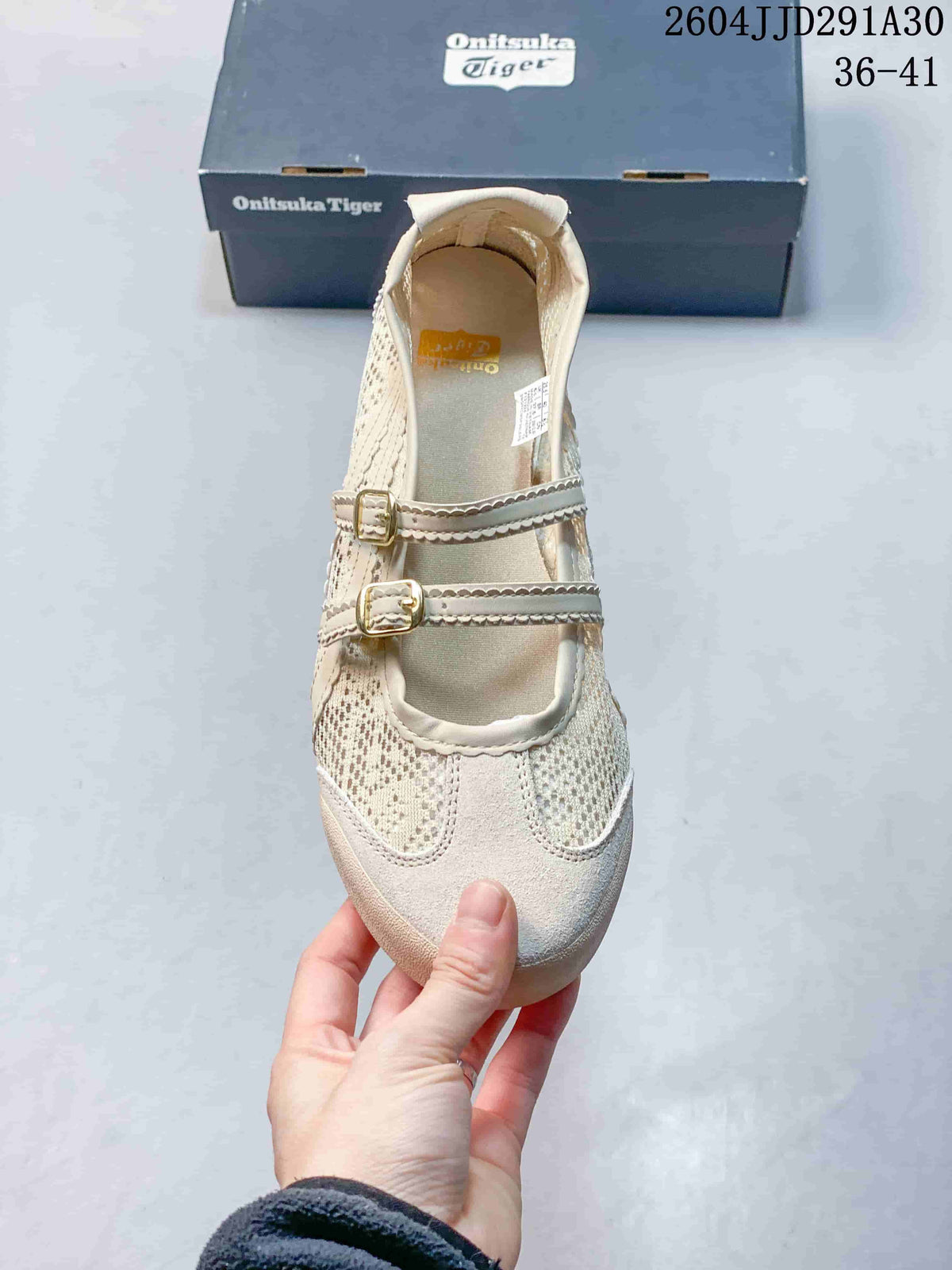 Top view showing the rounded toe, perforated panels, and two metal buckle straps.
