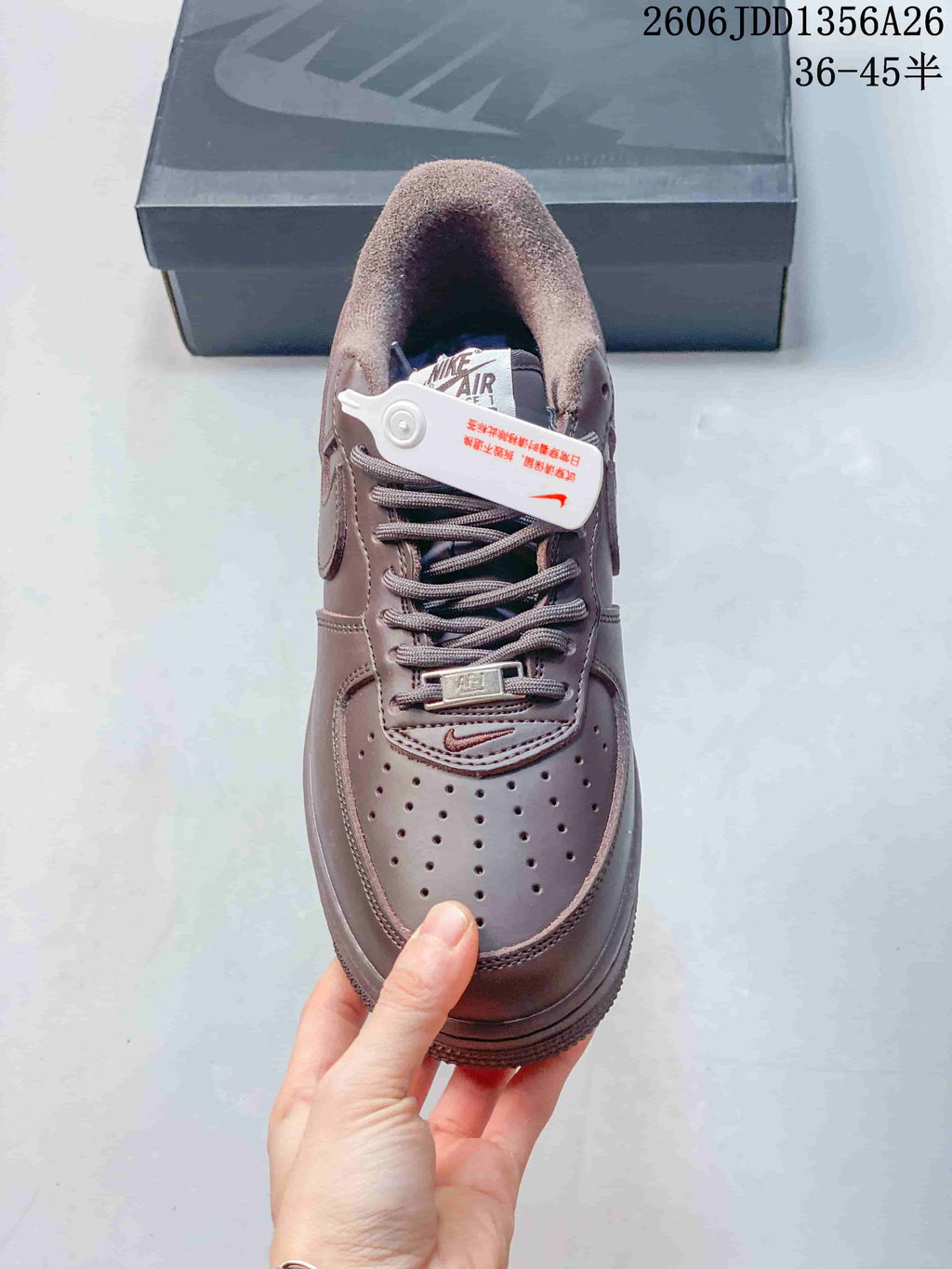 Top view of the brown sneaker showing the laces and perforated toe
