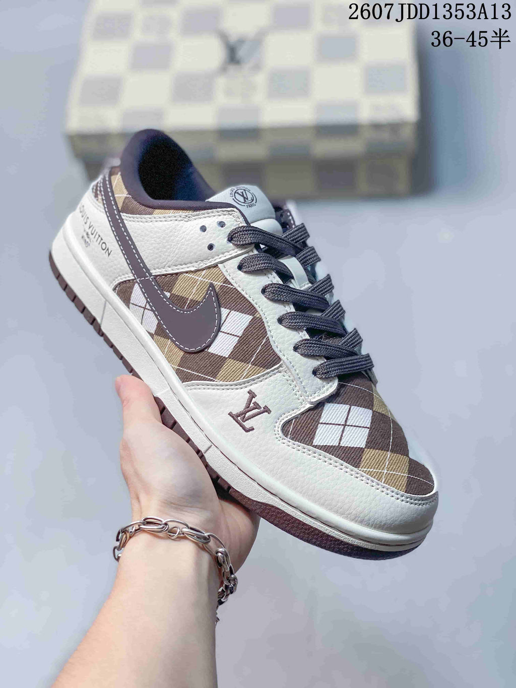 Angled side view showing the white and brown plaid upper, dark swoosh, and outsole.