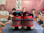 Rear view of red Nike basketball shoes showing number 12 embroidery and contrasting heel details.