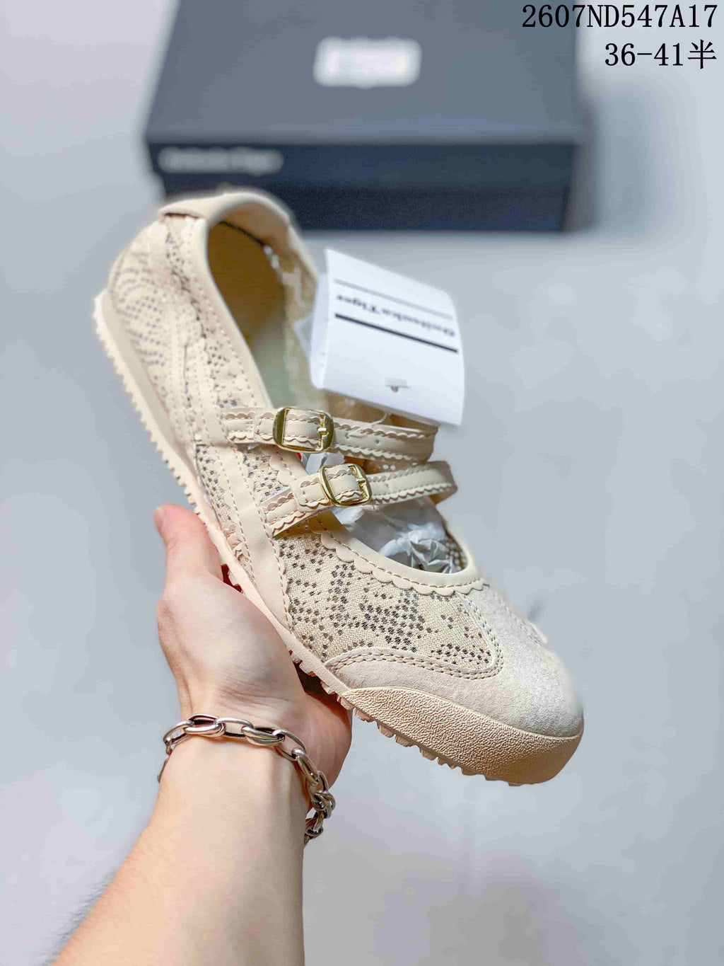 Cream Mary Jane sneaker with a speckled patterned upper, two buckles and a light sole.