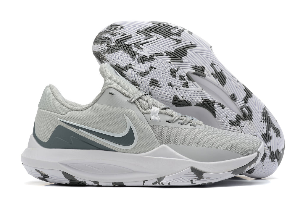 Light gray basketball shoe with dark gray accents and a patterned outsole.