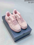 Pair of soft pink Nike Air Force 1 '07 low-top sneakers displayed on a shoebox.