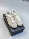 Pair of light gray and off-white ASICS Japan S sneakers displayed on a black shoebox; style code 2507 JJD320A08 and size range marking are visible at the top right.
