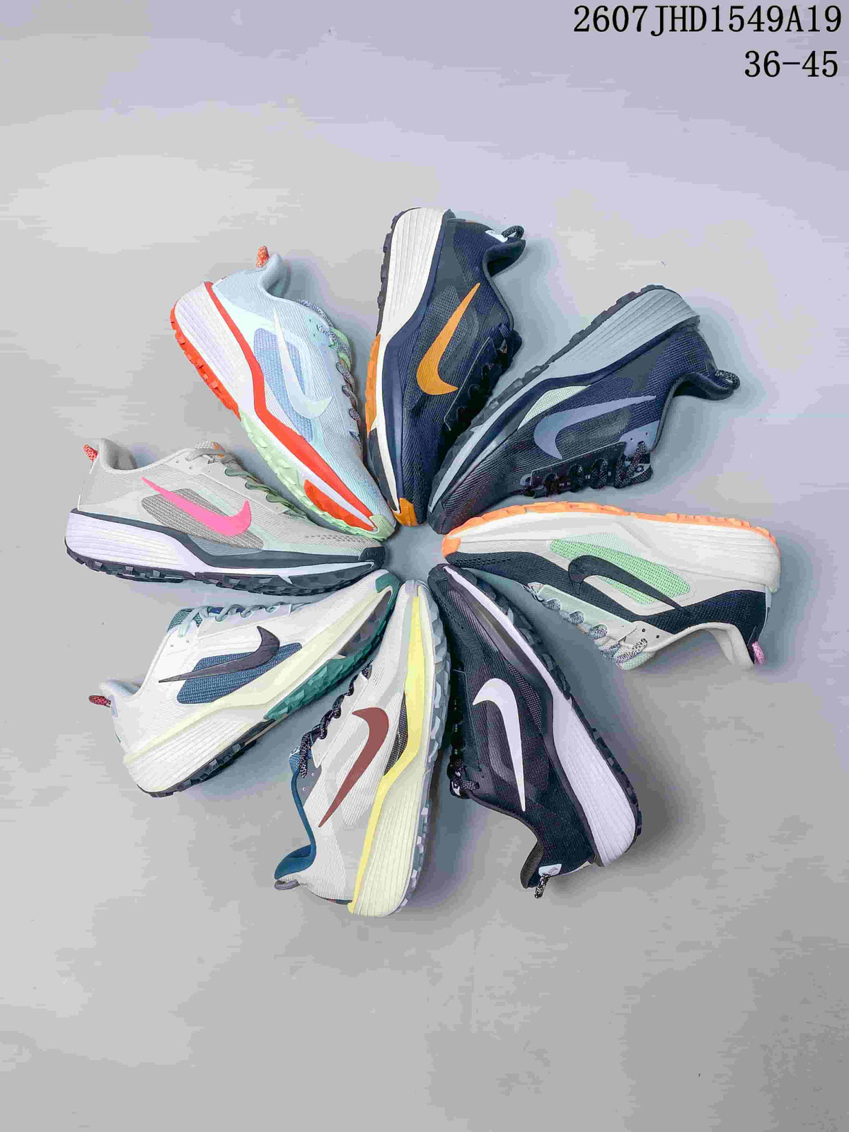 Several Nike Zoom Fly 5 sneakers arranged in a circular display, showing the available color combinations.