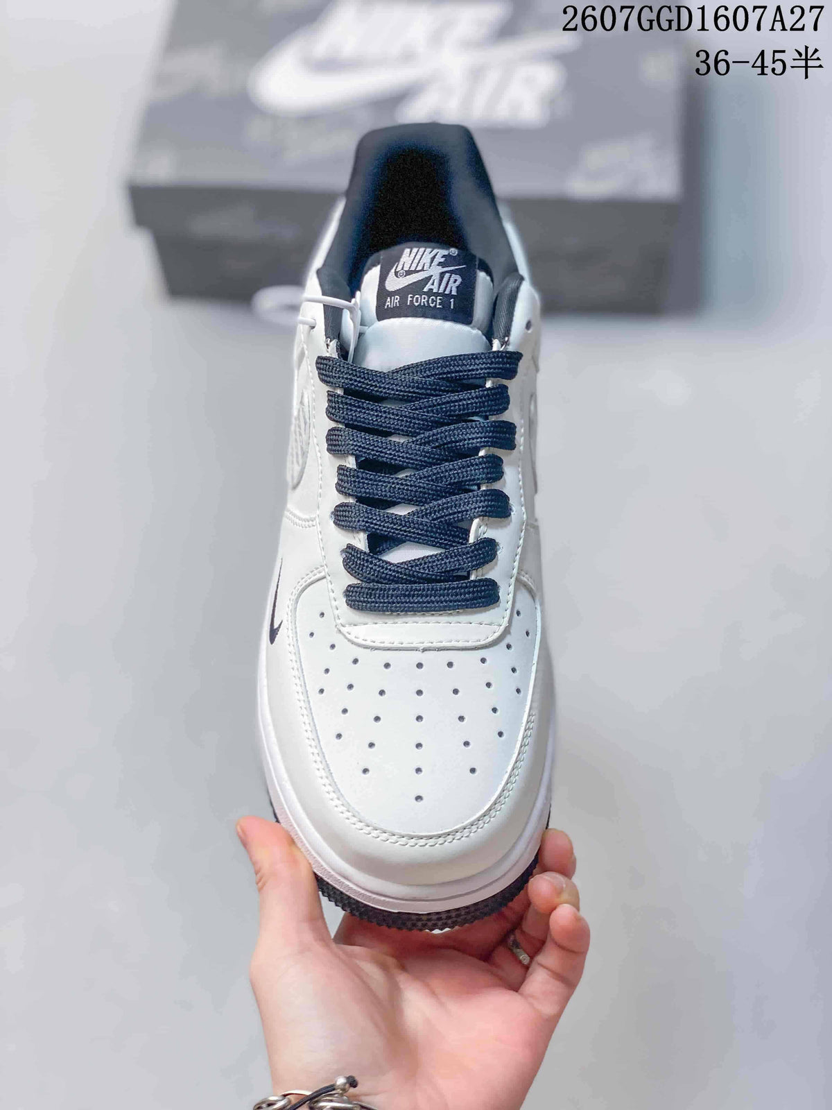 Top view showing the perforated white toe box, dark laces, padded collar, and Nike Air Force 1 tongue label.