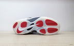 Outsole view of Nike Air Foamposite One sneakers with red traction sections