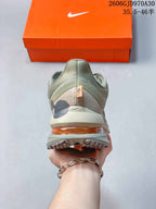 Rear view showing the heel and visible orange cushioning element.