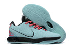 Light aqua Nike basketball shoes with black and pink accents.