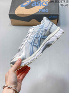 Side view showing mesh panels, layered overlays, and the sculpted sole