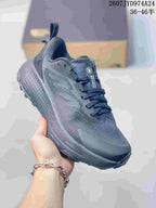 Angled side view of the dark gray The North Face Altamesa 500 sneaker showing the lace-up upper, side branding, and trail-style outsole.