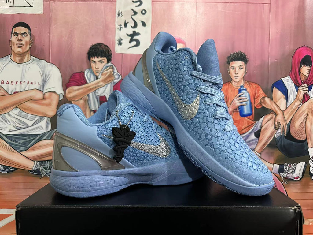 Pair of blue-gray Nike Kobe basketball shoes arranged at an angle