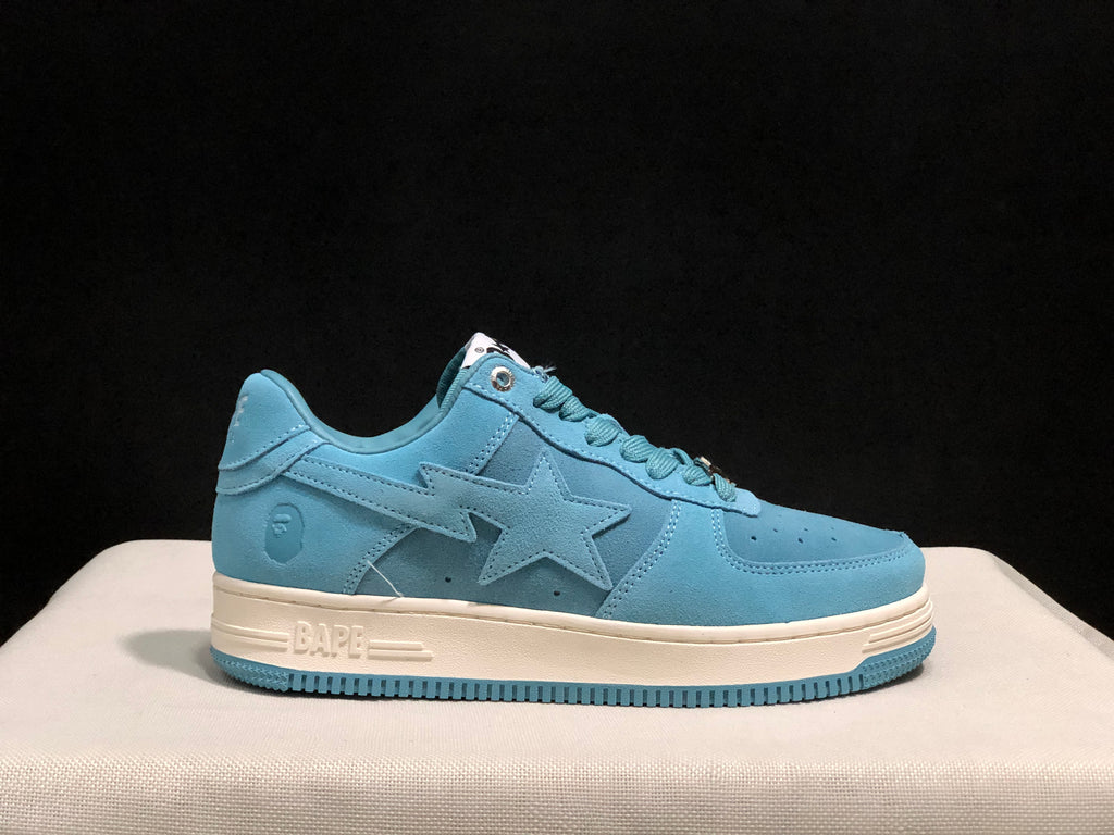 Outer side profile of one light blue sneaker showing the star-shaped panel, heel emblem, off-white midsole, and blue outsole.