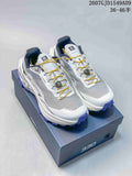 Pair of Kailas Fuga Ex 330 shoes in grey and white with purple outsoles and yellow laces, displayed on a 330-branded box.