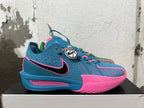 Side view of the blue-and-pink Nike GT Cut 3 basketball shoe