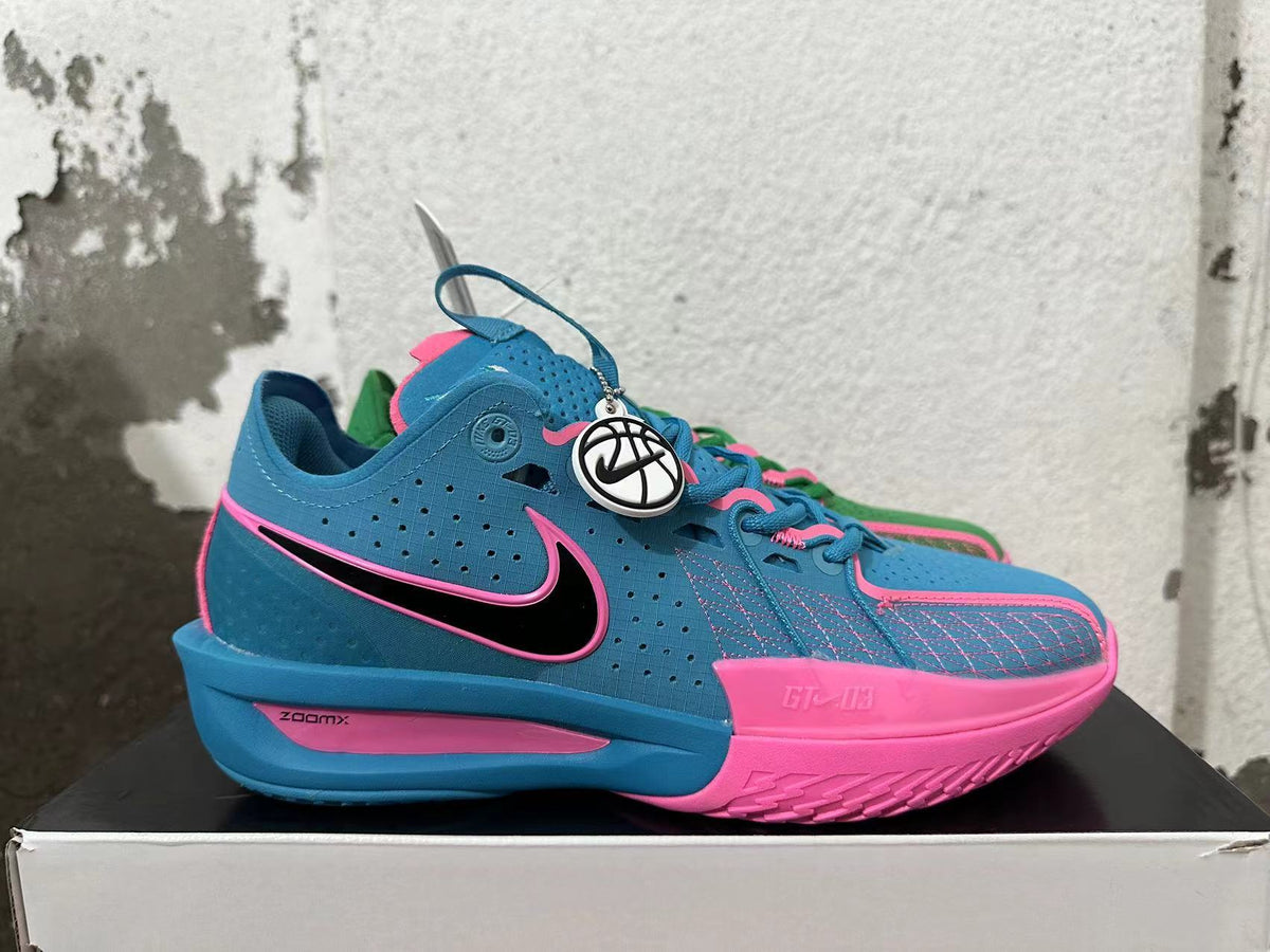 Side view of the blue-and-pink Nike GT Cut 3 basketball shoe