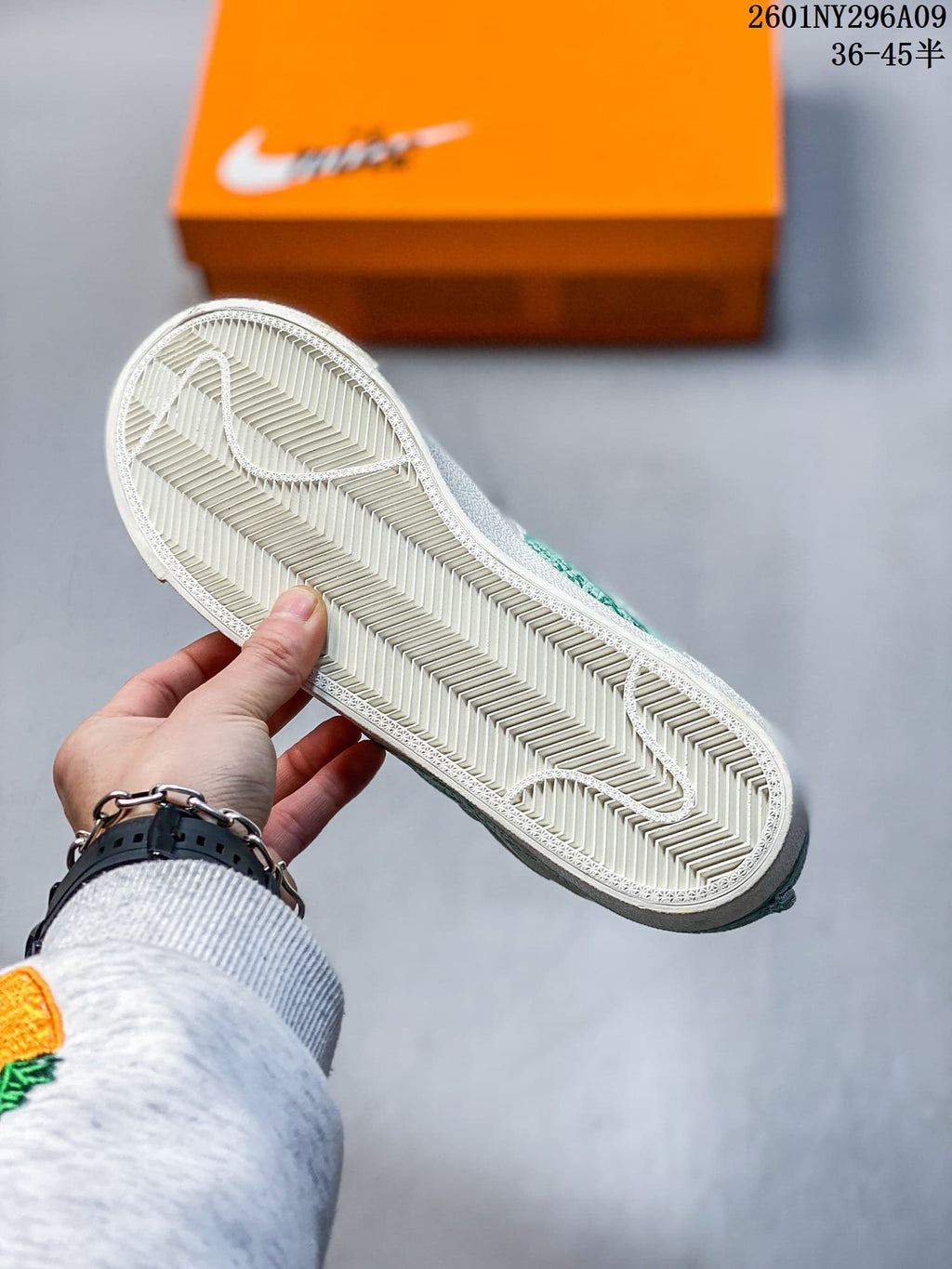 Close-up of the sneaker outsole showing a textured herringbone tread pattern.