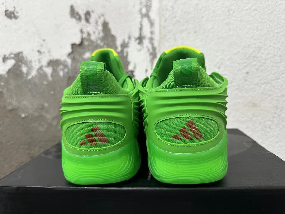 Rear view of green Adidas sneakers with heel logos and sculpted soles