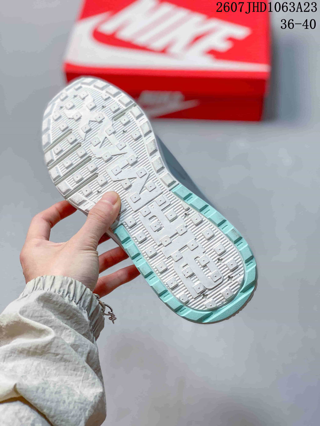 Outsole view showing the textured tread pattern and turquoise perimeter of a Nike Air Max Viva sneaker.