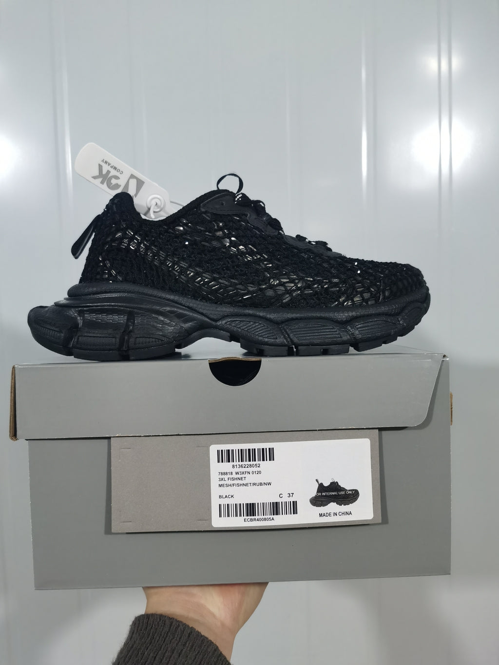 Black sneaker displayed on its box; the label shows 3XL FISHNET, BLACK, and a photographed size of C 37.