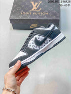 Side view of a grey and white patterned low-top sneaker