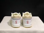 Rear view showing padded cream collars, white heel panels and red embroidered heel graphics.