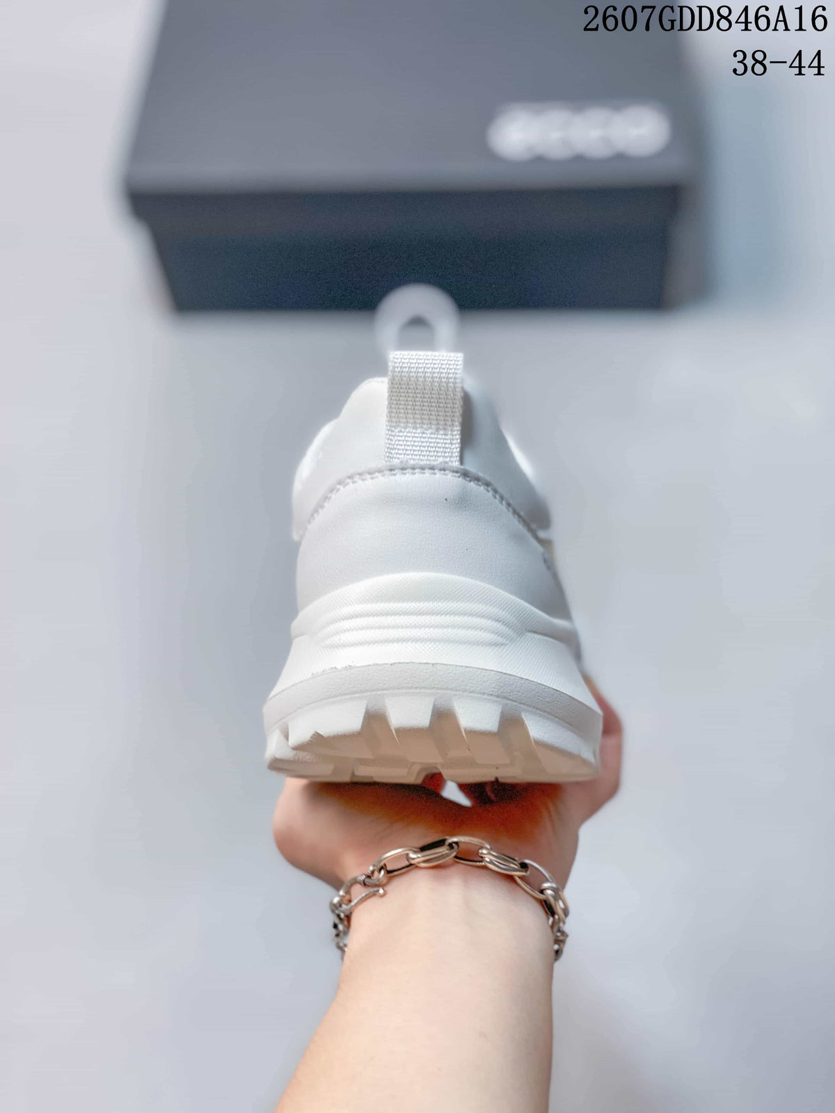 Rear view of the white sneaker showing the padded heel, pull tab and textured outsole.