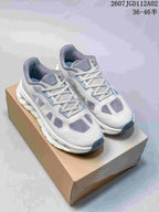 Pair of light grey and white Cloudtilt Remix sneakers with purple-grey accents