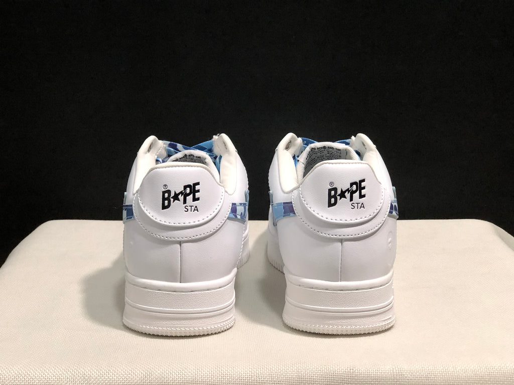Rear view of the pair showing BAPE STA heel labels and white padded collars.