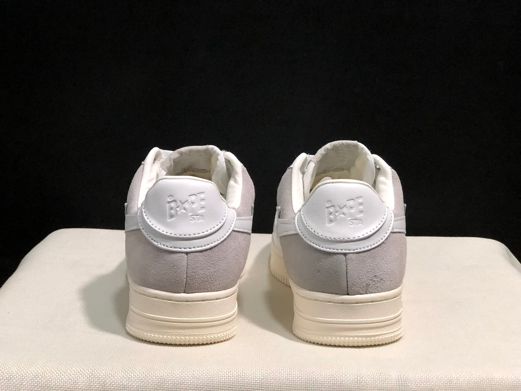 Rear view of the pair showing gray heel panels and BAPE Sta branding.
