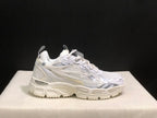 Side view of a single white Off-White sneaker highlighting the lace-up upper and textured chunky outsole.