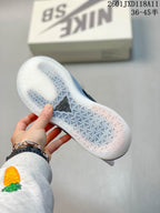 Bottom view of a Nike SB shoe showing the translucent outsole and repeating textured tread pattern.