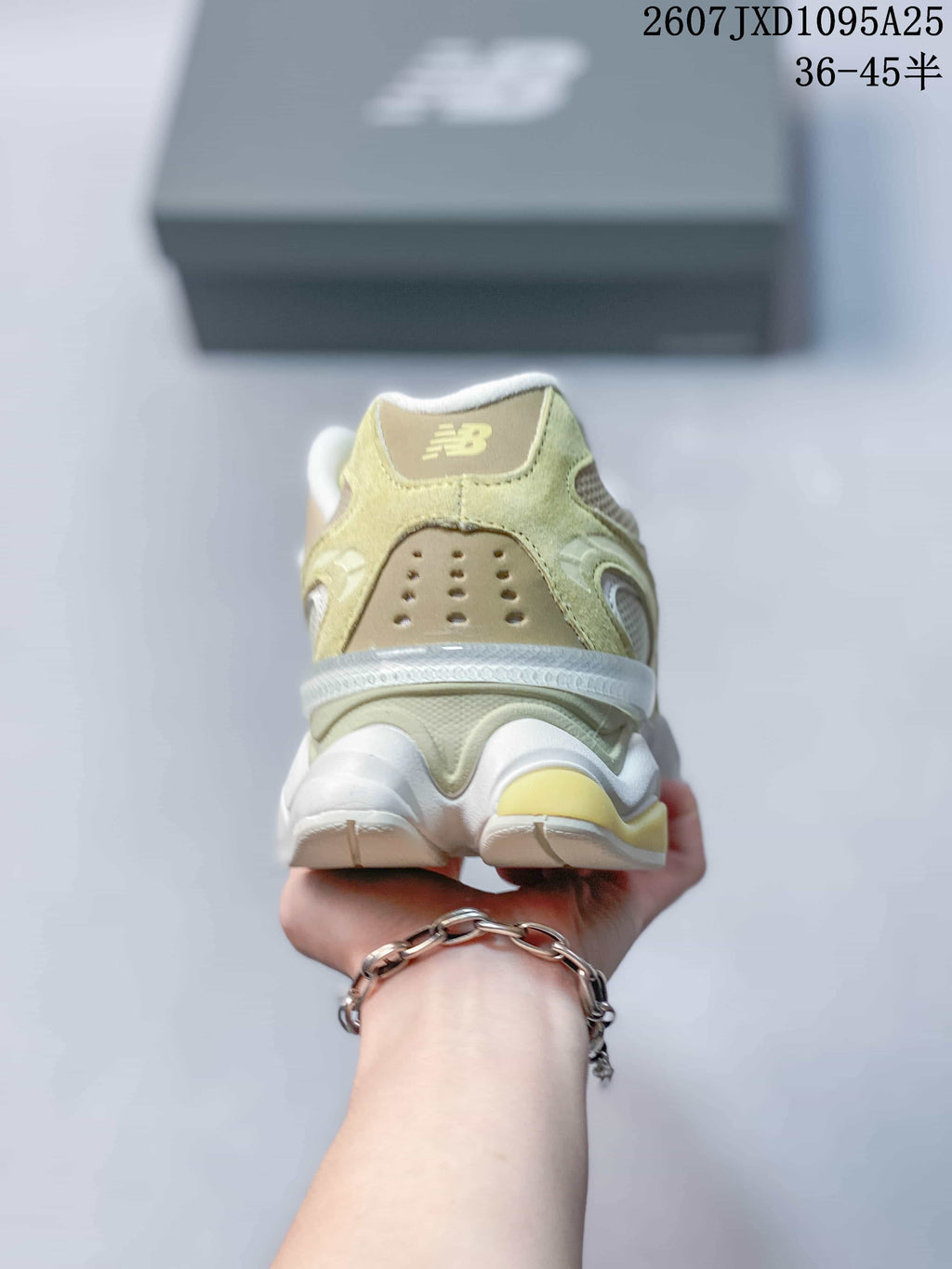 Rear view of a New Balance 9060R sneaker showing the padded heel and layered sole design.