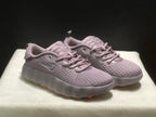 Three-quarter view of the purple Nike Mind 002 sneaker pair.