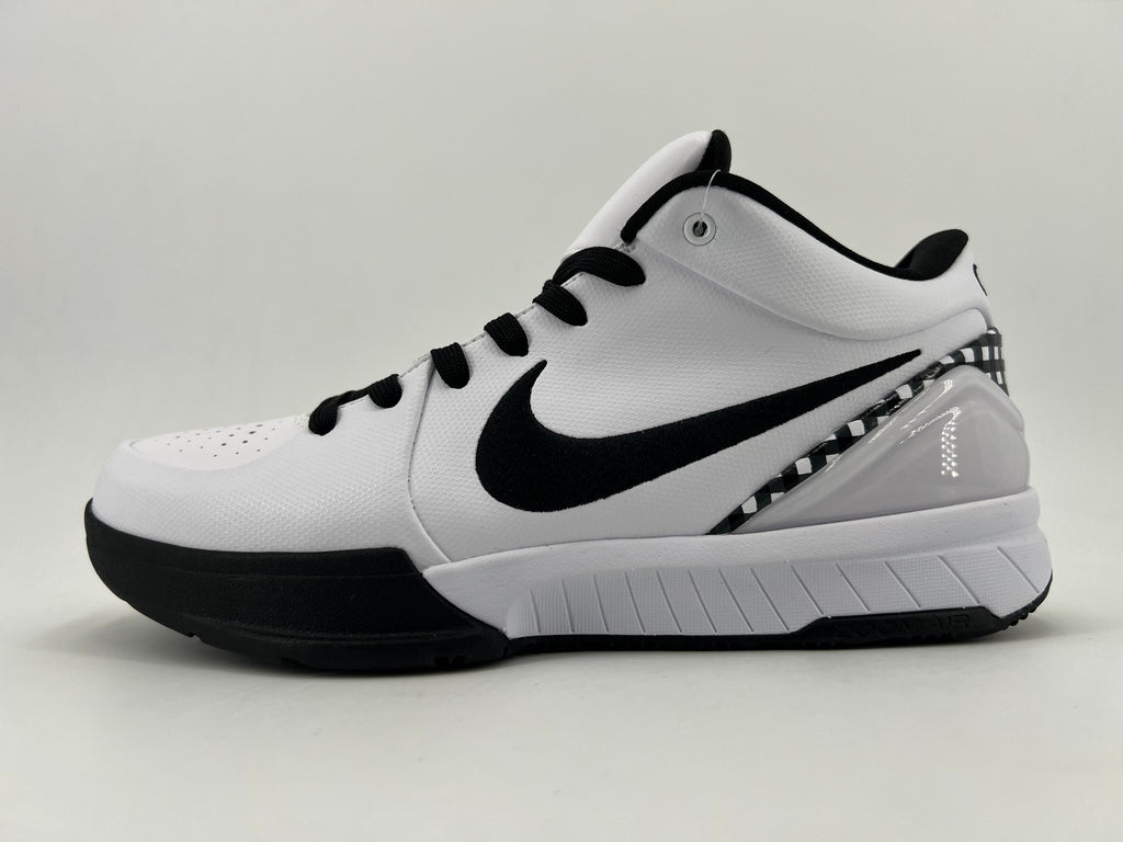 Side profile of the white shoe with black Swoosh and checkerboard heel trim