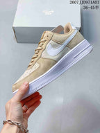 Side view of a beige and white Nike Air Force 1 '07 low-top sneaker