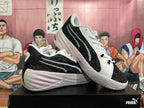 Two black and white basketball shoes displayed from side and three-quarter angles