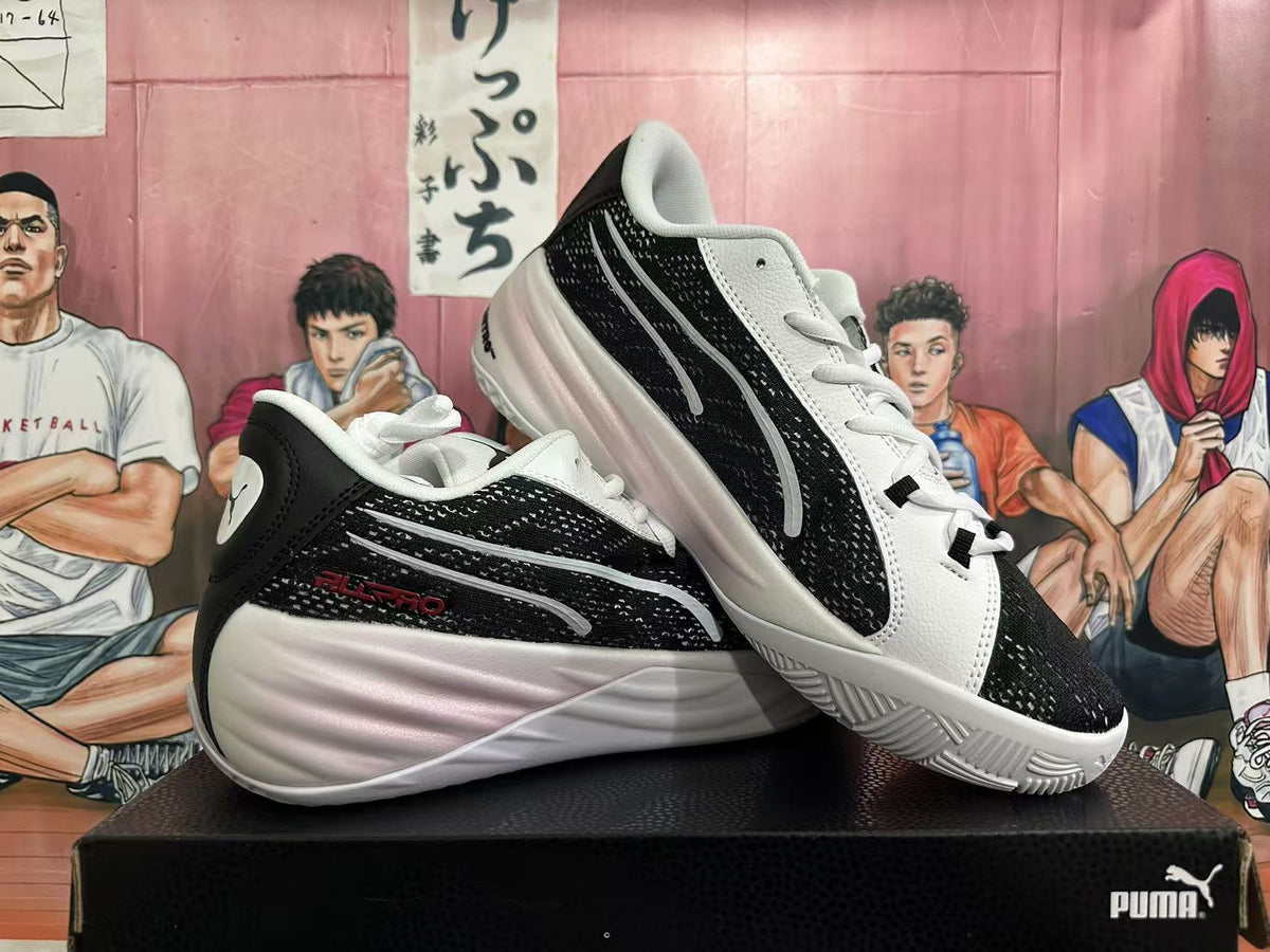 Two black and white basketball shoes displayed from side and three-quarter angles