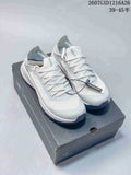 Pair of white Arc'teryx Sylan sneakers displayed on a branded shoebox, with the style reference 2607GXD1216A26 and size text visible above.