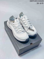 Pair of white Arc'teryx Sylan sneakers displayed on a branded shoebox, with the style reference 2607GXD1216A26 and size text visible above.