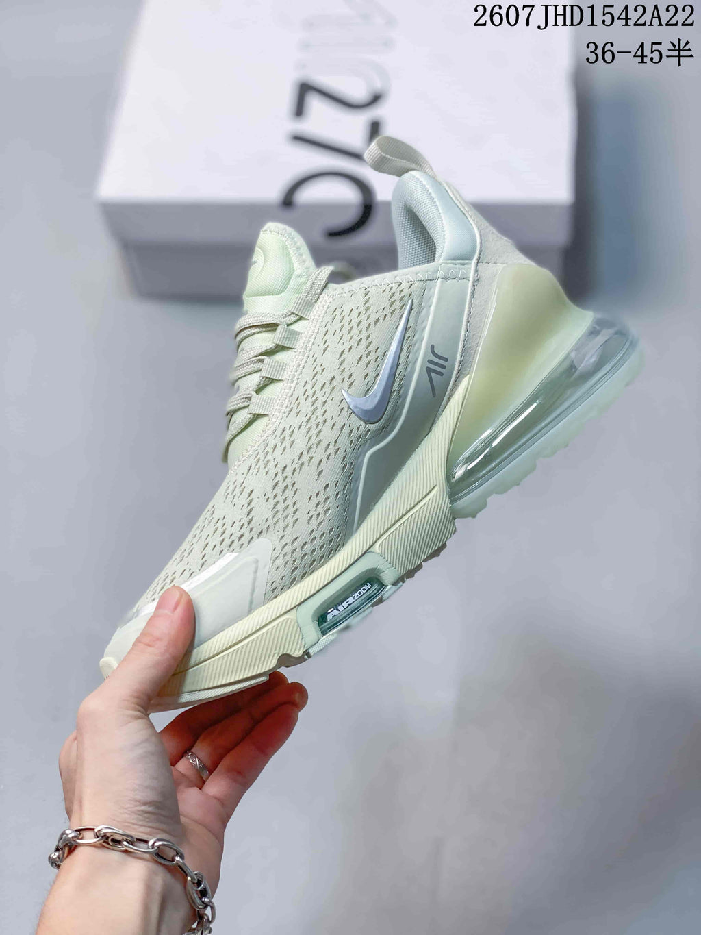 Side view showing the perforated upper, Swoosh logo, lace-up design, and transparent heel Air unit.