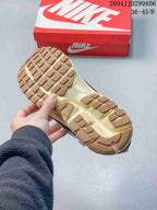 Underside of the sneaker showing a tan and off-white textured rubber outsole with BRS 1000 marking.
