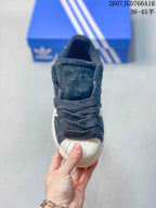 Front view showing the shell toe, dark laces, and tongue branding.