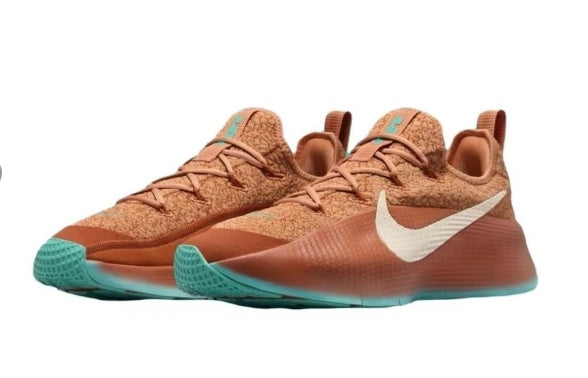 Pair of rust-brown and teal training shoes shown in a side view