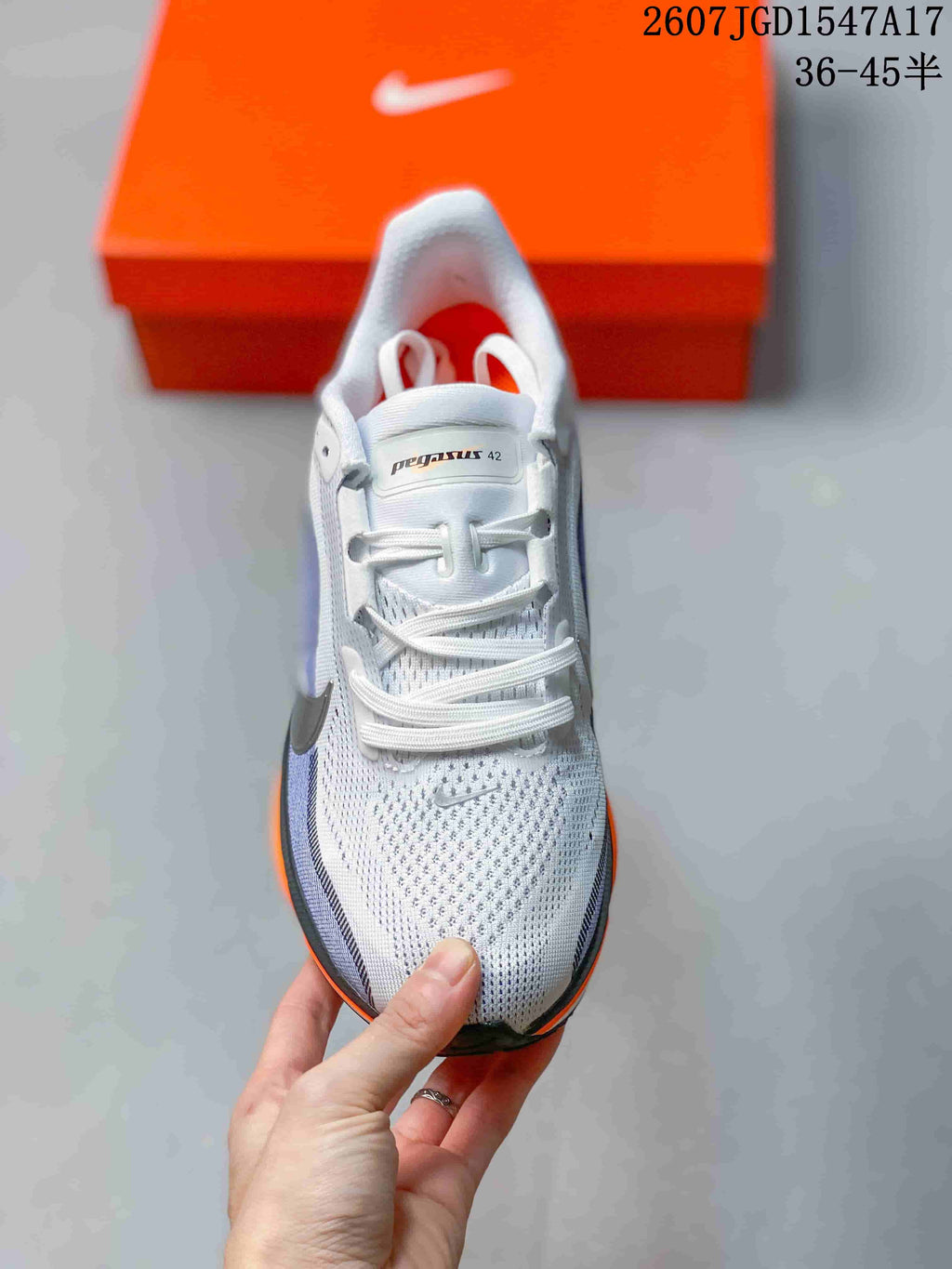 Top view of a Nike Pegasus 42 shoe showing white laces, a textured toe box and Pegasus 42 tongue branding.