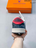 Rear view showing a red heel tab, dark heel panel, white midsole and dark outsole.