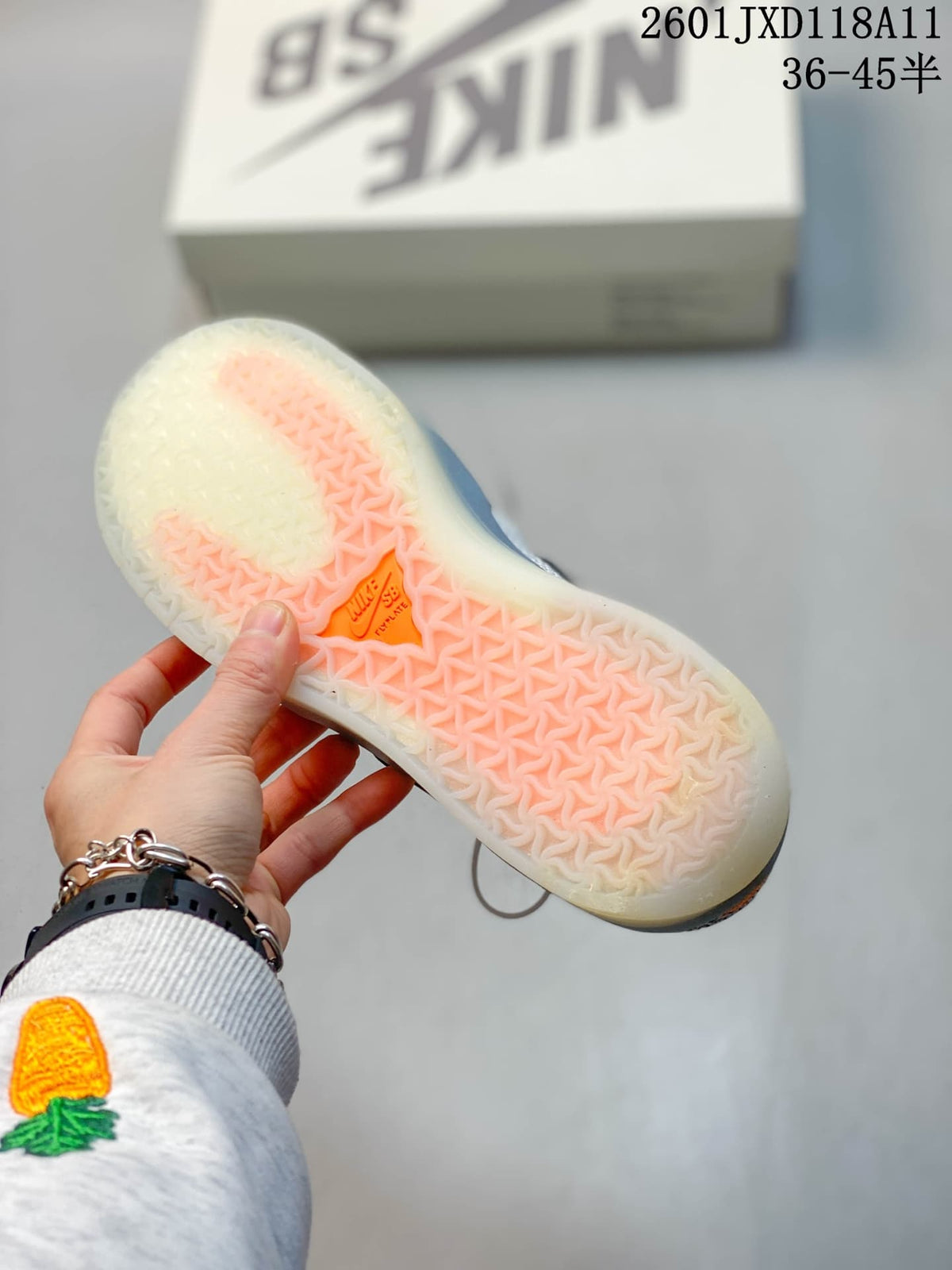 Underside view of a Nike SB PS8 sneaker showing the translucent outsole and textured tread pattern.