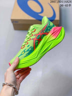 Side profile highlighting the lime green upper, red and blue graphics, and pink midsole section.
