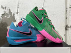 Mismatched blue-and-pink and green-and-pink Nike basketball shoes shown together