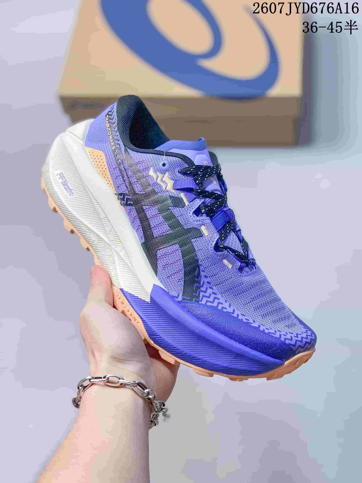 Angled side view showing the purple-blue upper, lace system, white midsole and tan outsole.